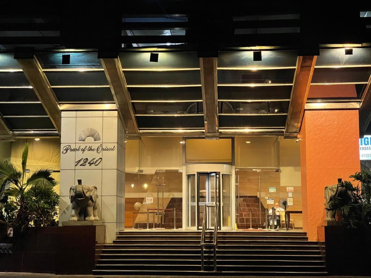 Pearl Of The Orient Tower, In Front Of Us Embassy Apartment Manila Exterior photo